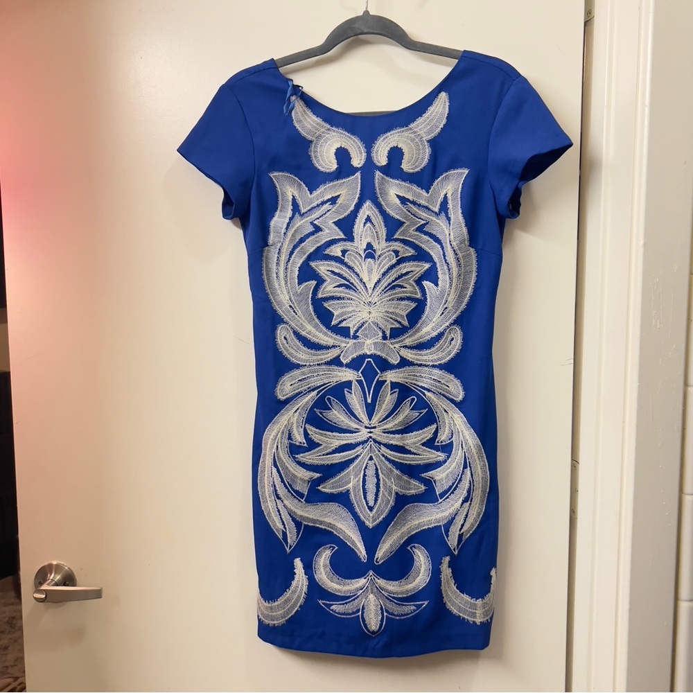 Blue boutique dress form fitting